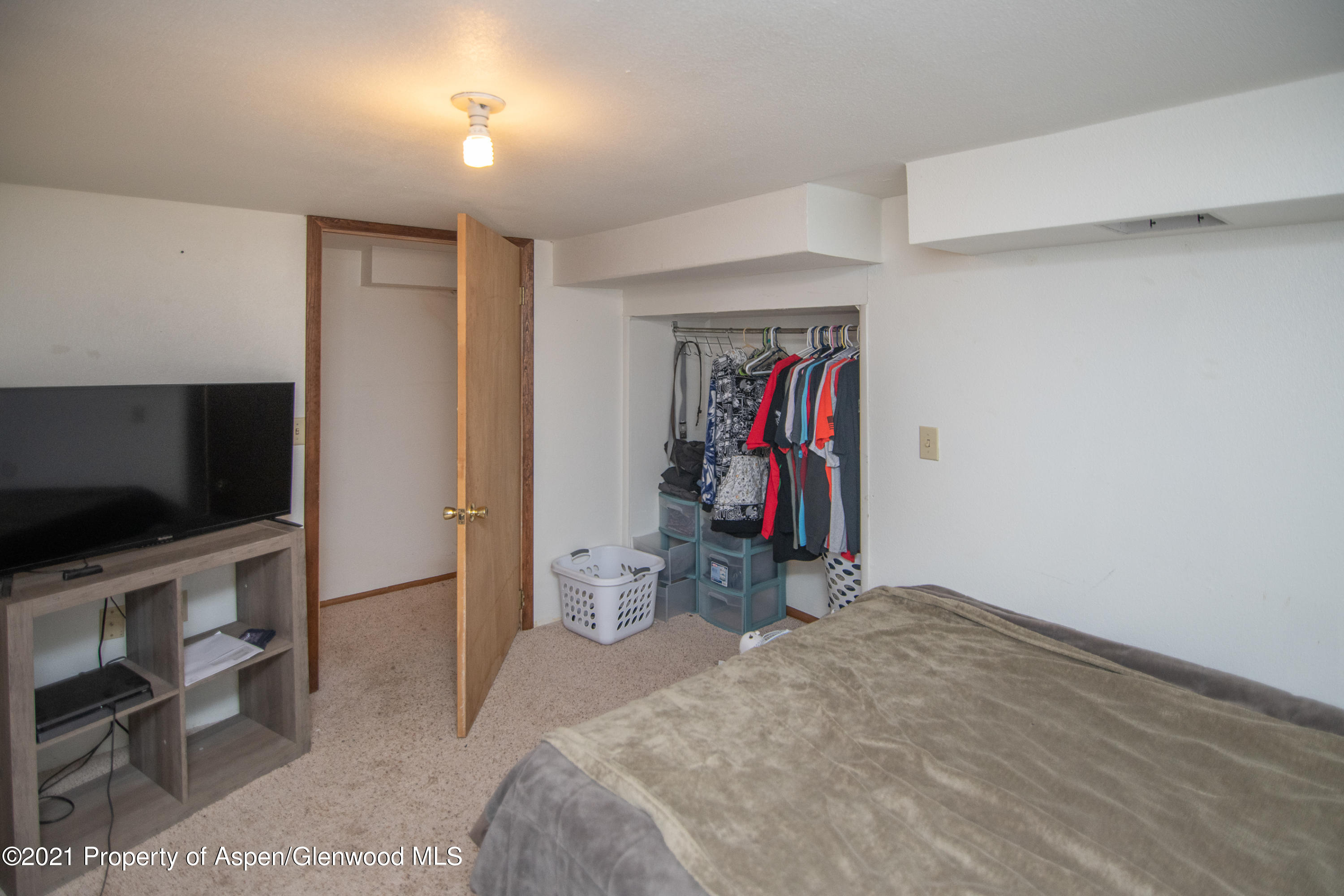 761 Rose Street Craig, CO 81625 - Photo 35 of 42 a view of a room with closet flat screen tv and windows