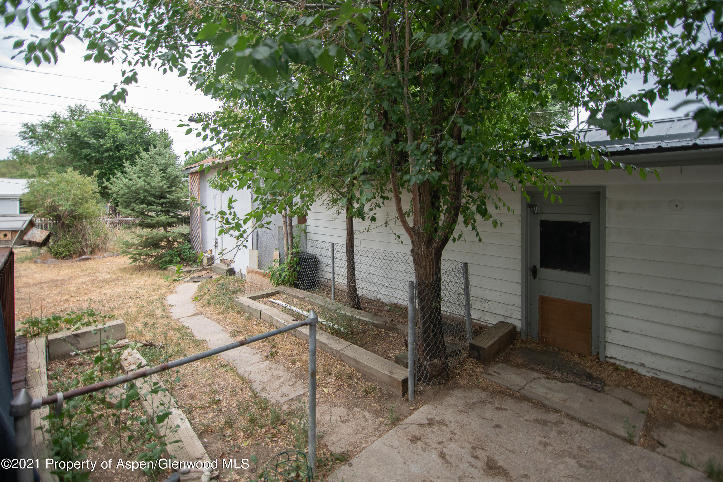 761 Rose Street Craig, CO 81625 - Photo 40 of 42 a view of a house with a tree