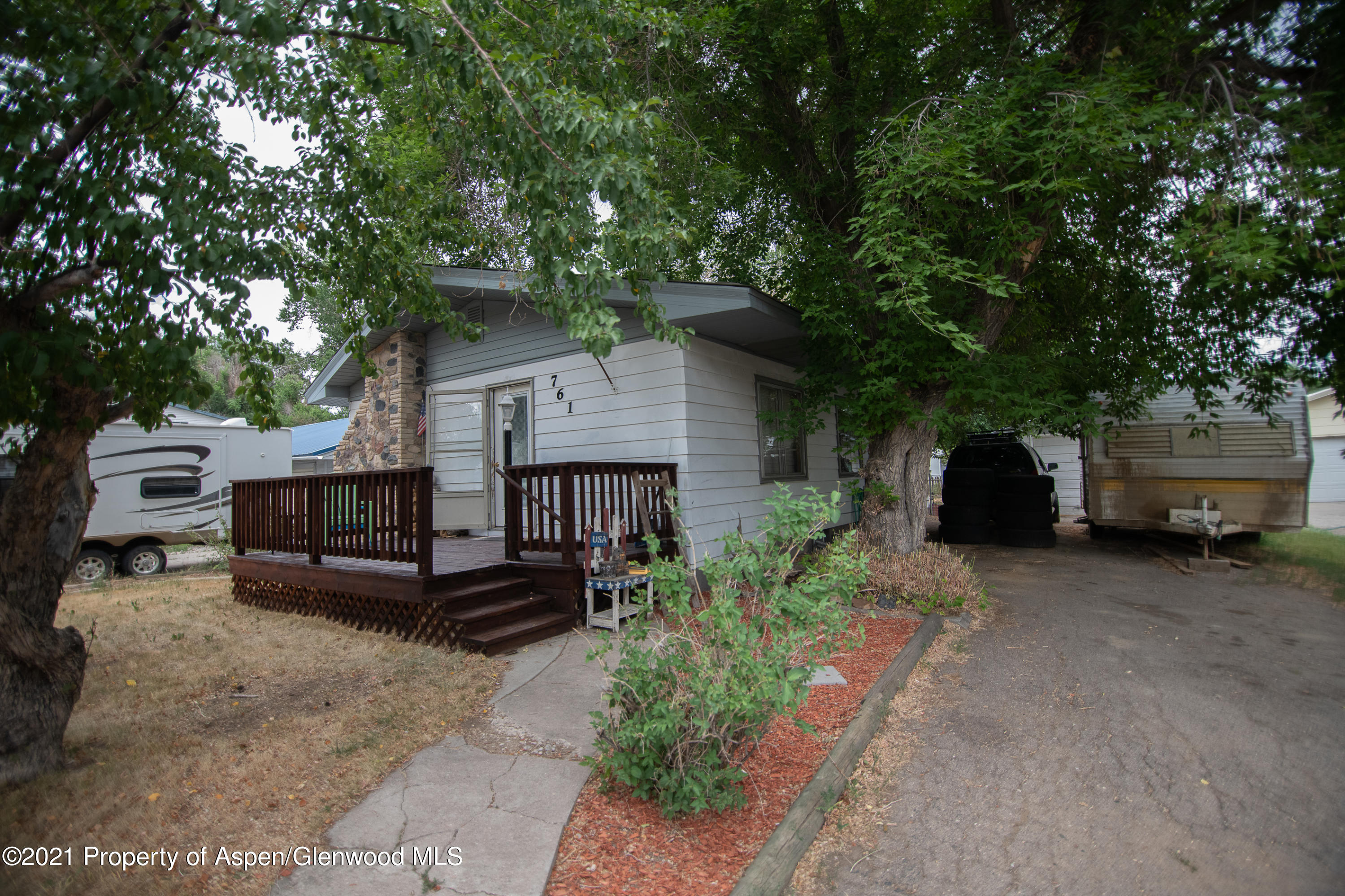 761 Rose Street Craig, CO 81625 - Photo 41 of 42 a front view of a house with a garden