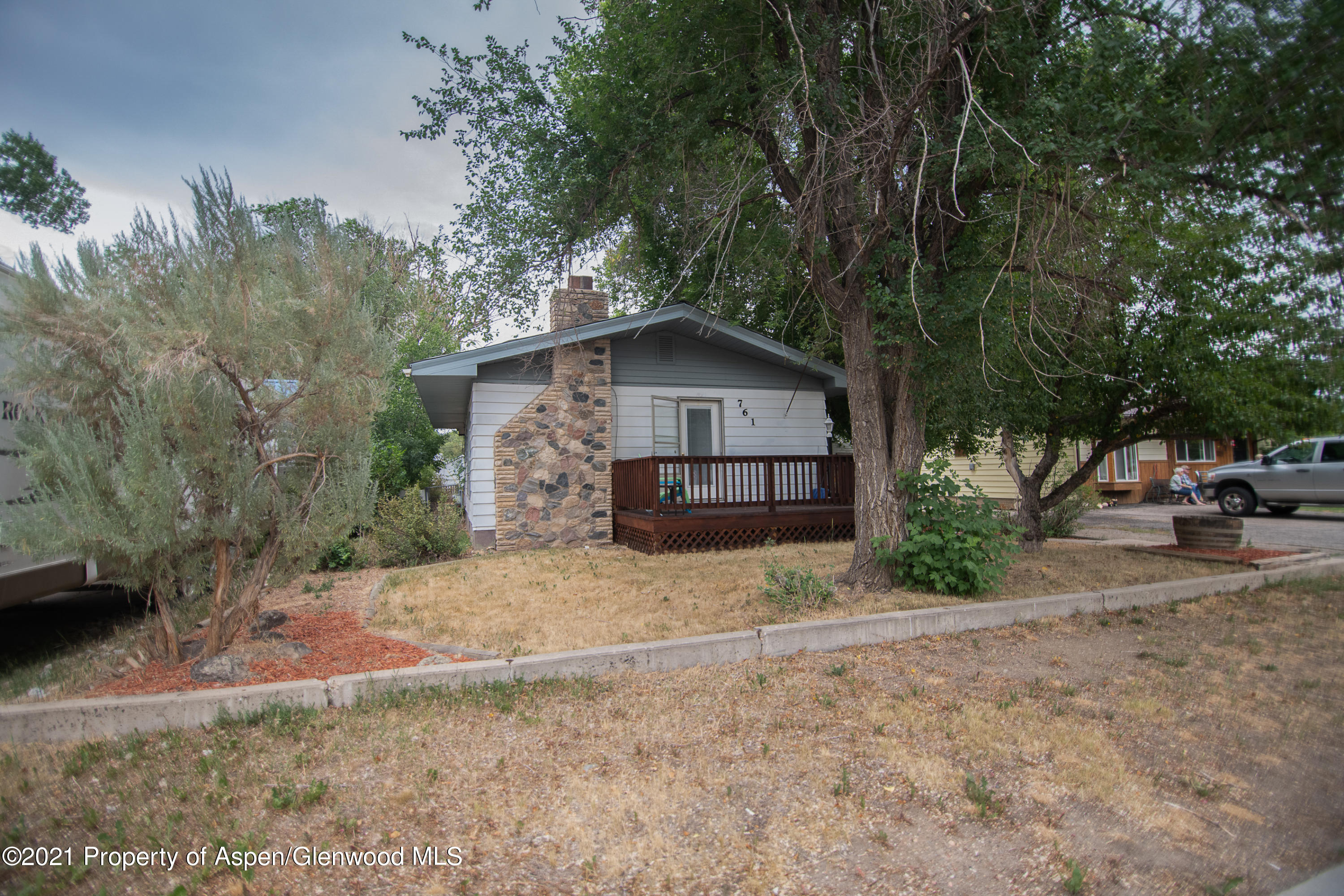 761 Rose Street Craig, CO 81625 - Photo 42 of 42 a yellow house with trees in front of it