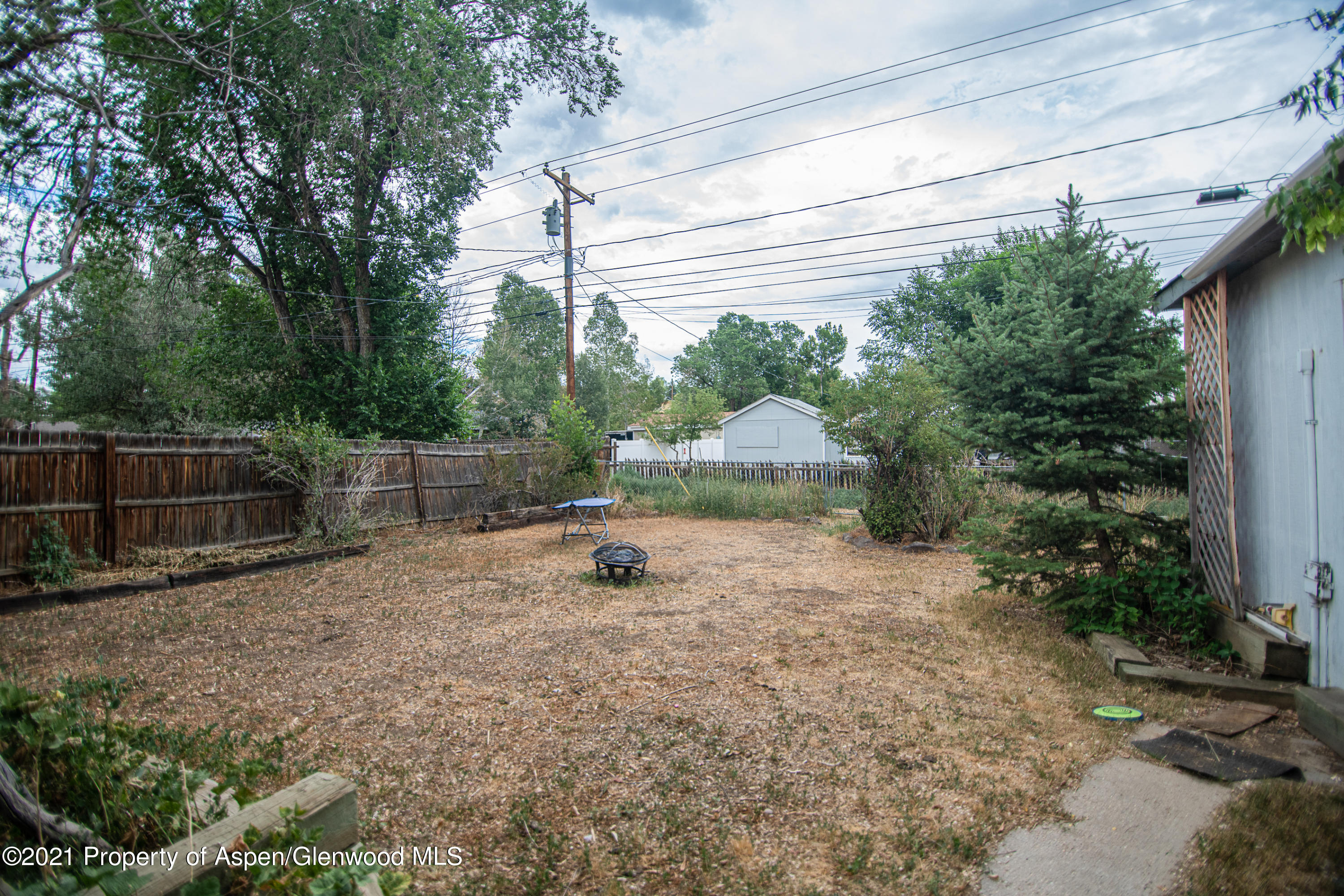 761 Rose Street Craig, CO 81625 - Photo 5 of 42 a view of backyard with trampoline