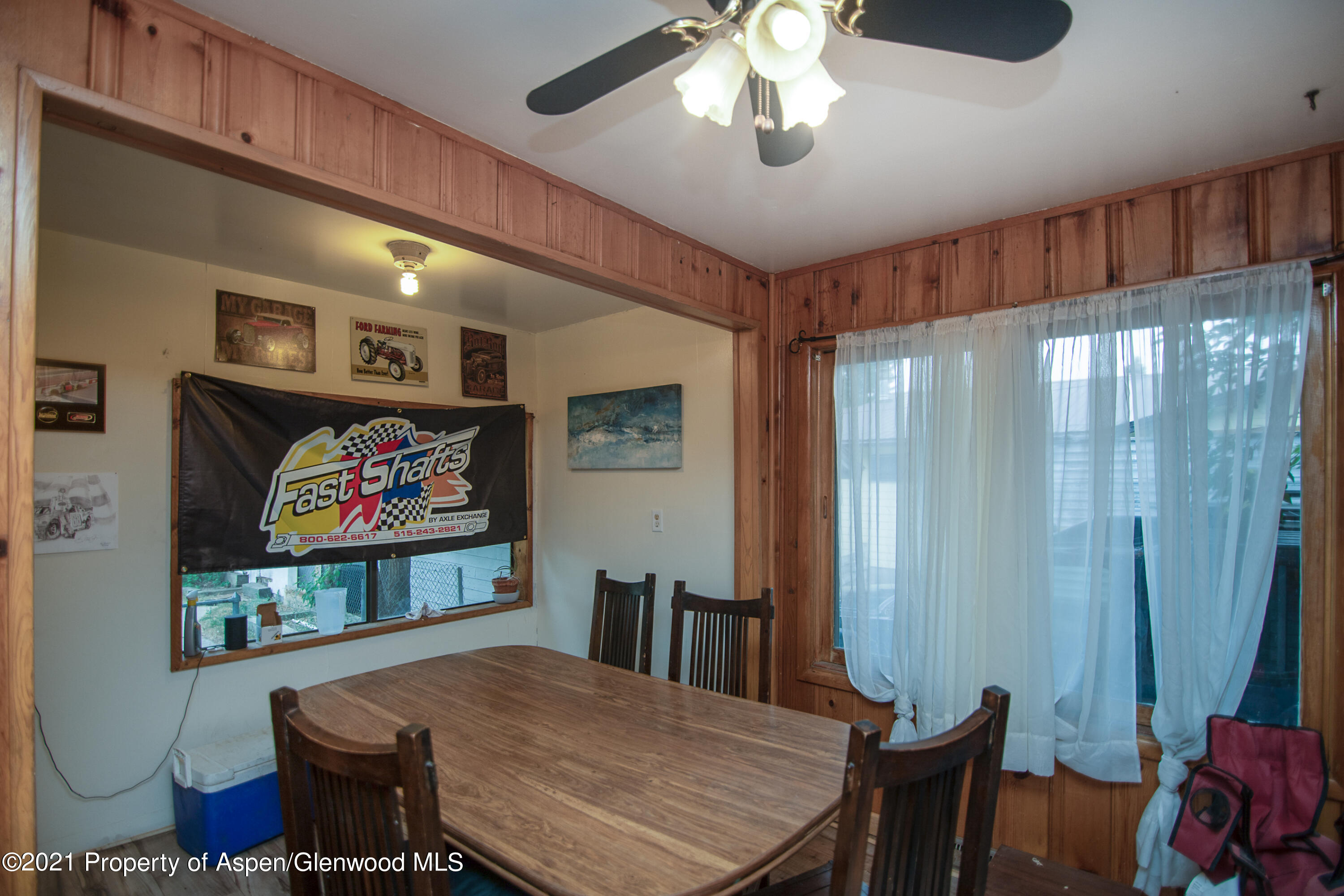761 Rose Street Craig, CO 81625 - Photo 9 of 42 a view of a dining room with furniture a chandelier and wooden floor
