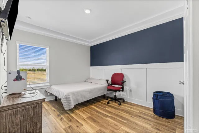 a bedroom with a bed and a table