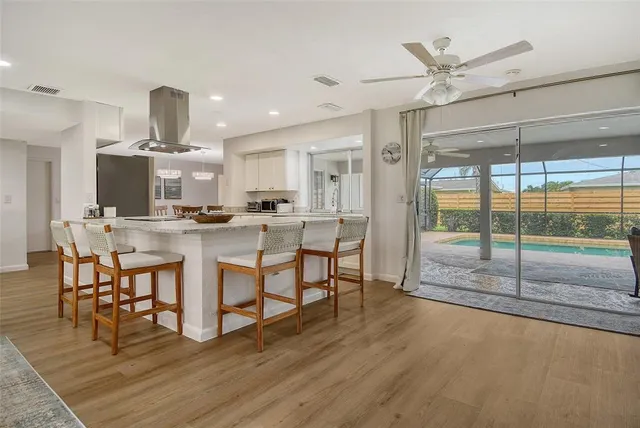 a kitchen with a table and chairs in it