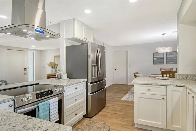 a kitchen with a sink cabinets and window