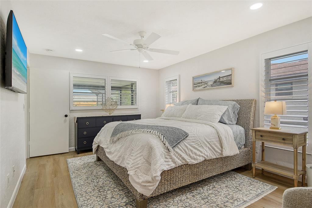 6722 Roxbury Drive Sarasota, FL 34231 - Photo 37 of 87 a bedroom with a bed and a flat screen tv