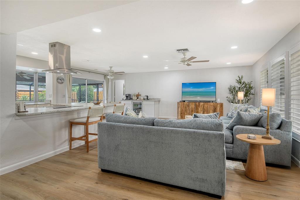 6722 Roxbury Drive Sarasota, FL 34231 - Photo 10 of 87 a living room with furniture and a wooden floor