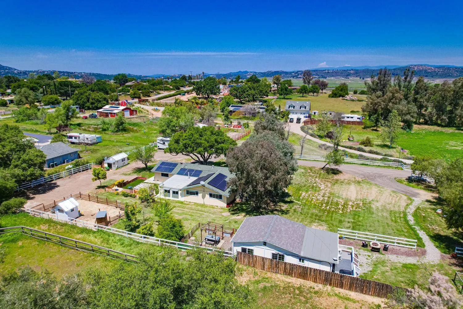 17048 Handlebar Road Ramona, CA 92065 - Photo 64 of 75 an aerial view of residential houses with outdoor space and trees