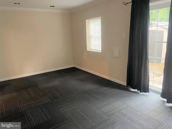 a view of an empty room and window