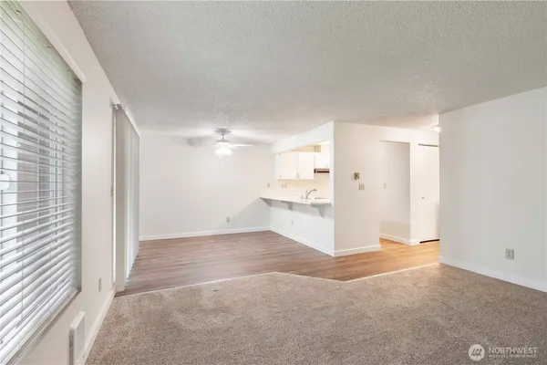 a kitchen with stainless steel appliances a sink a stove and a refrigerator