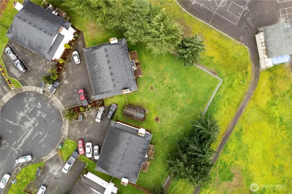 an aerial view of a residential houses with outdoor space
