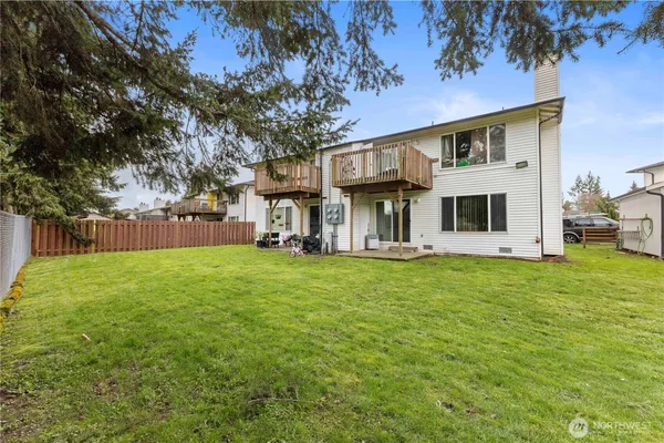 a view of a house with a backyard