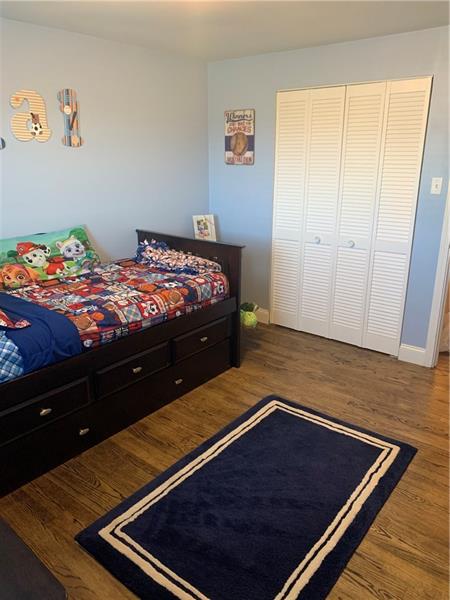 1137 Lindsay Road Carnegie, PA 15106 - Photo 14 of 25 2nd Bedroom with Spacious Closet Space, Refinished Original Hardwood Flooring, and Custom-Cut Cordless Blinds