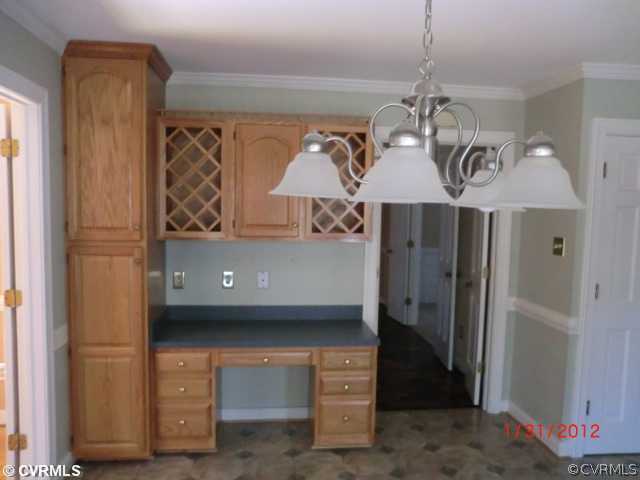 3204 Fortunes Ridge Road Midlothian, VA 23112 - Photo 3 of 12 a view of a hallway with a chandelier