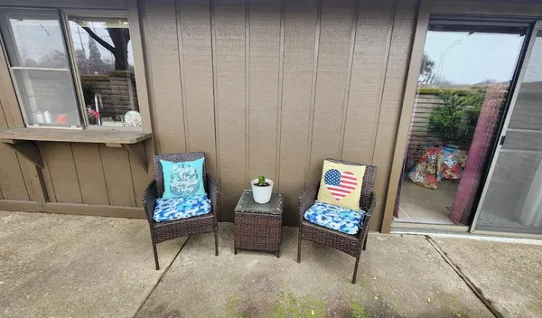 a living room with furniture and a window