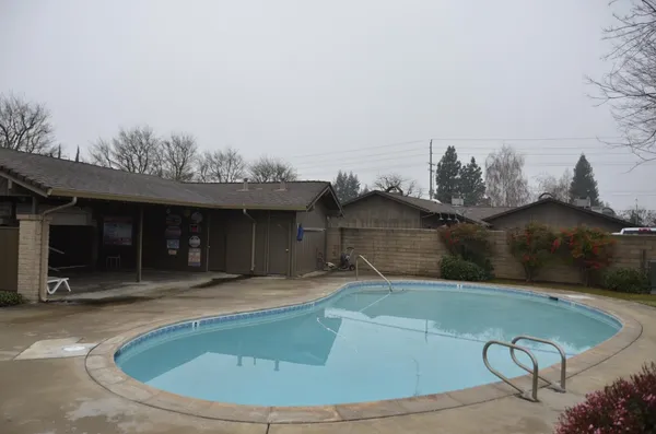 a view of a house with a swimming pool