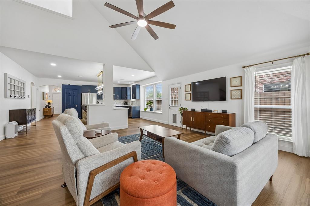 9217 Inverness Drive Rowlett, TX 75089 - Photo 13 of 40 Connected Great Room Layout — This open family room flows seamlessly into the updated kitchen, creating an easy everyday layout for relaxing, entertaining, and enjoying the heart of the home.