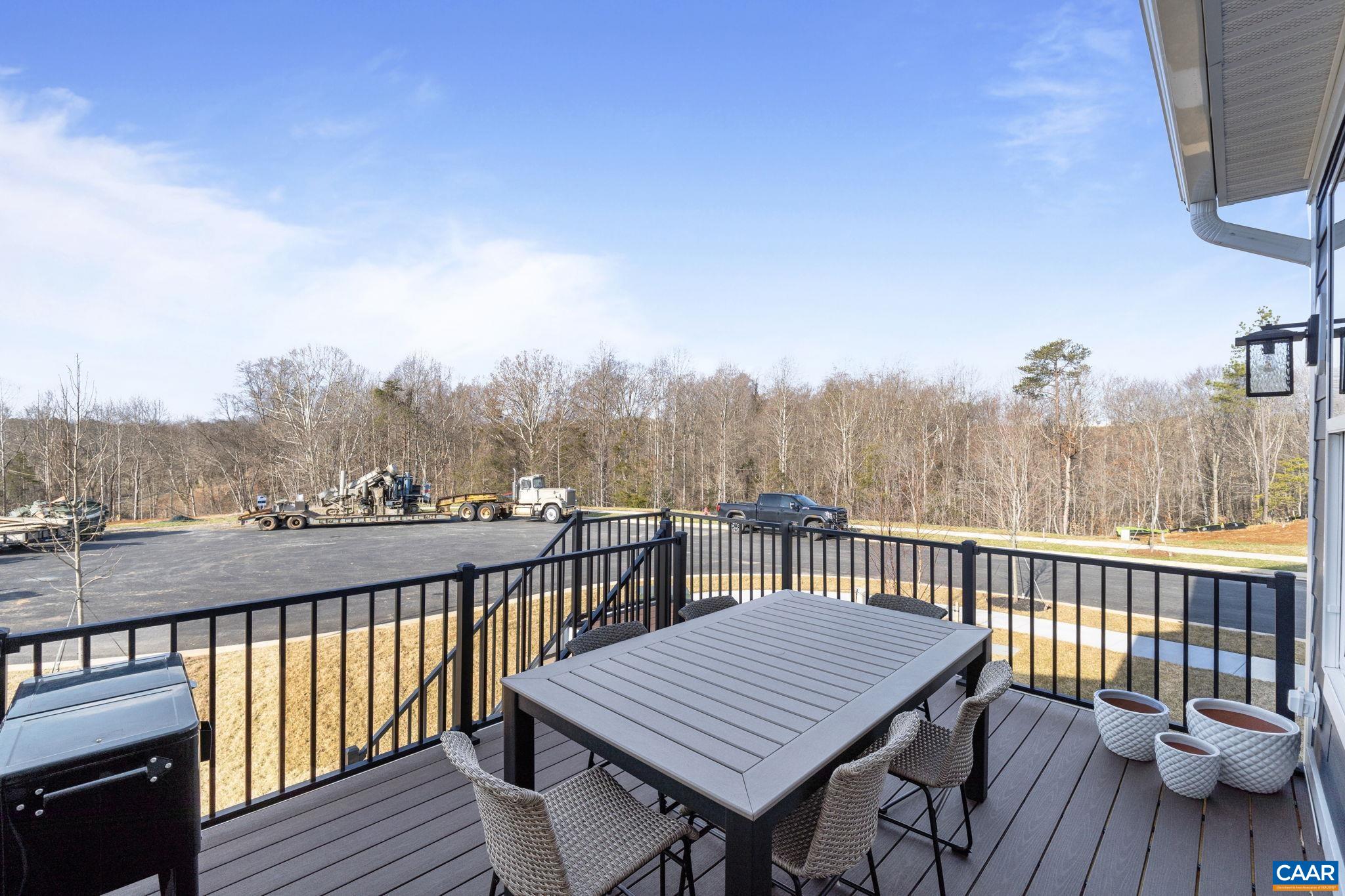 35 Mary Jackson Court Charlottesville, VA 22902 - Photo 27 of 56 a view of a balcony with wooden floor and outdoor seating