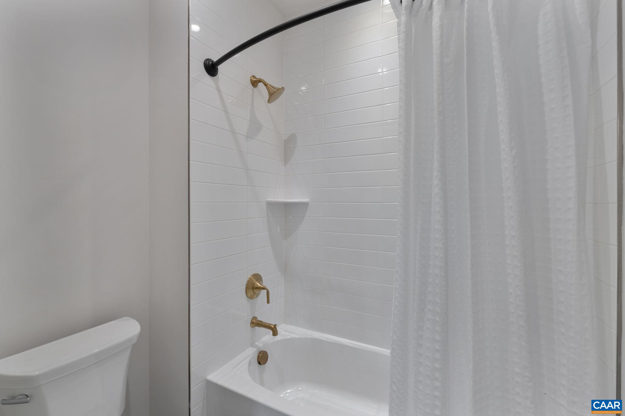 35 Mary Jackson Court Charlottesville, VA 22902 - Photo 40 of 56 a bathroom with a shower and a toilet