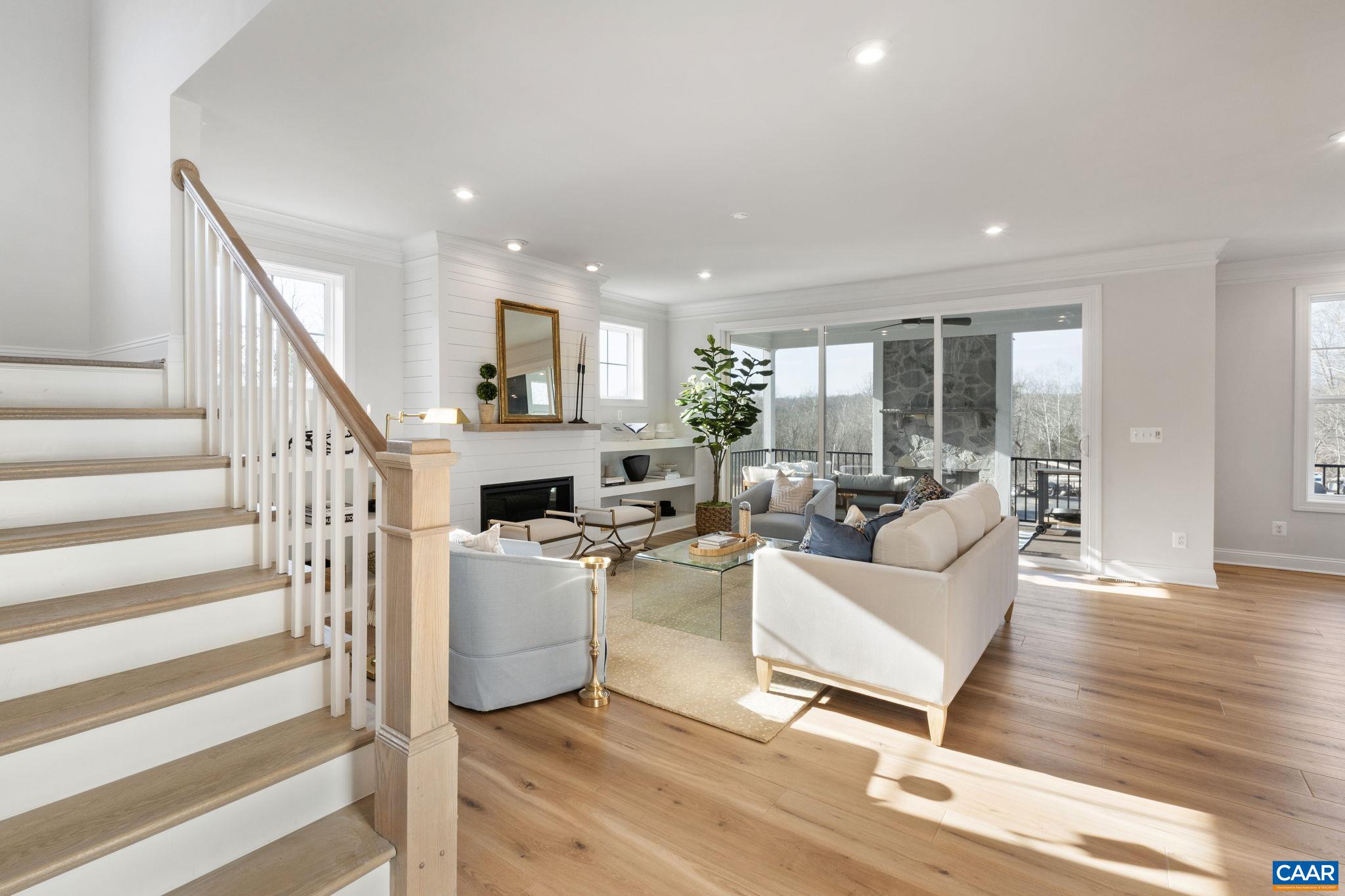 35 Mary Jackson Court Charlottesville, VA 22902 - Photo 10 of 56 a living room with fireplace furniture and a wooden floor