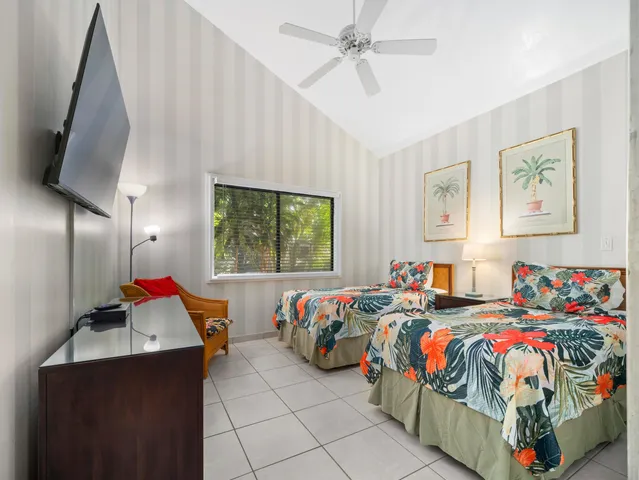 a bedroom that has a bed and a chair in it