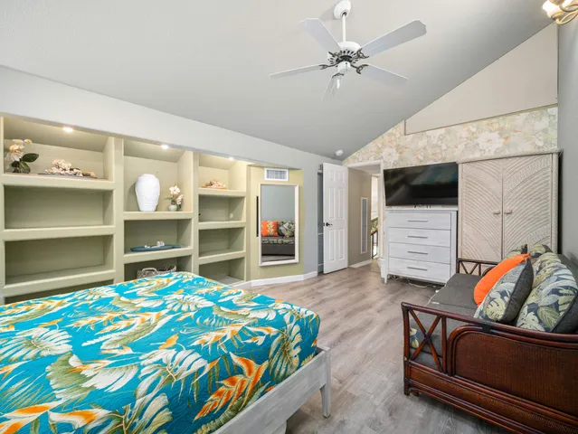 a bathroom with a shower sink and mirror