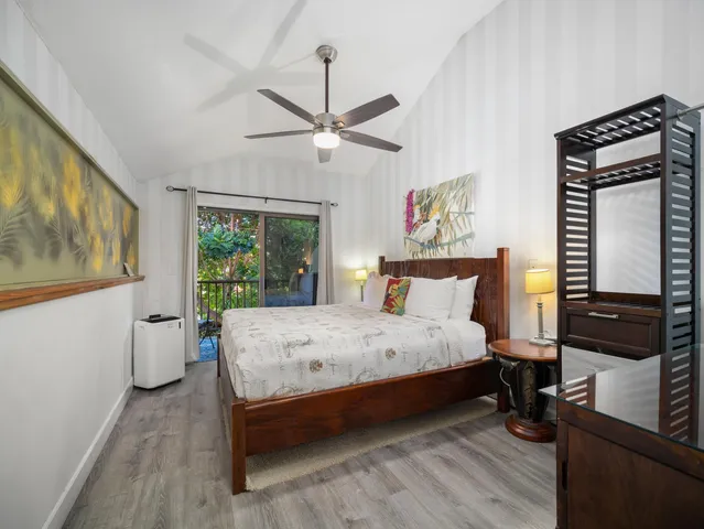 a view of a balcony with wooden floor and outdoor seating