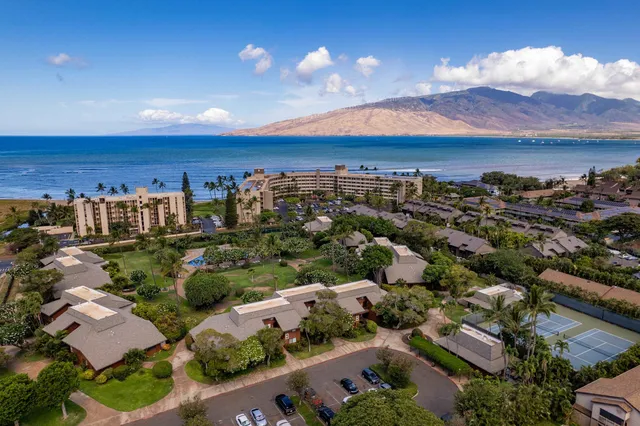 a view of an outdoor space and basketball court