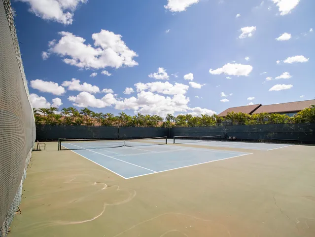 a view of a terrace with couches and city view