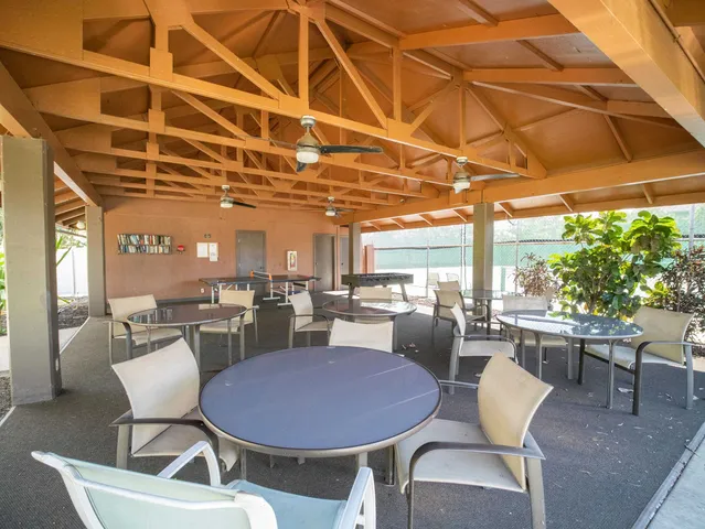 a view of a swimming pool with a yard