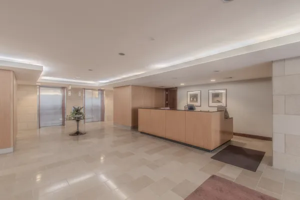 a view of hallway with wooden floor