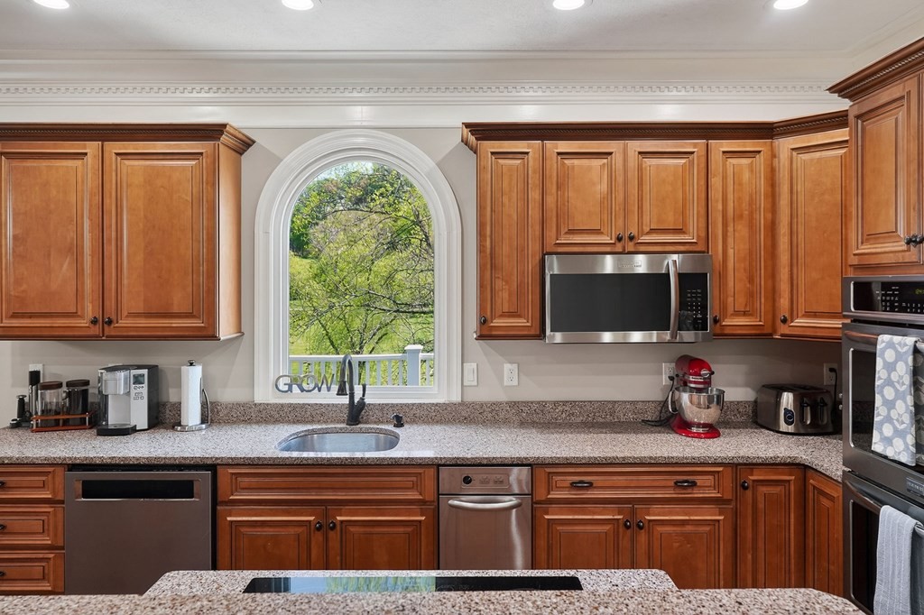 4671 Bunker Hill Road Cookeville, TN 38506 - Photo 12 of 87 a kitchen with stainless steel appliances granite countertop a refrigerator a sink a stove and cabinets