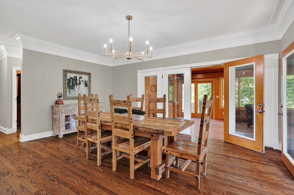 4671 Bunker Hill Road Cookeville, TN 38506 - Photo 17 of 87 a view of a dining room with furniture wooden floor and chandelier