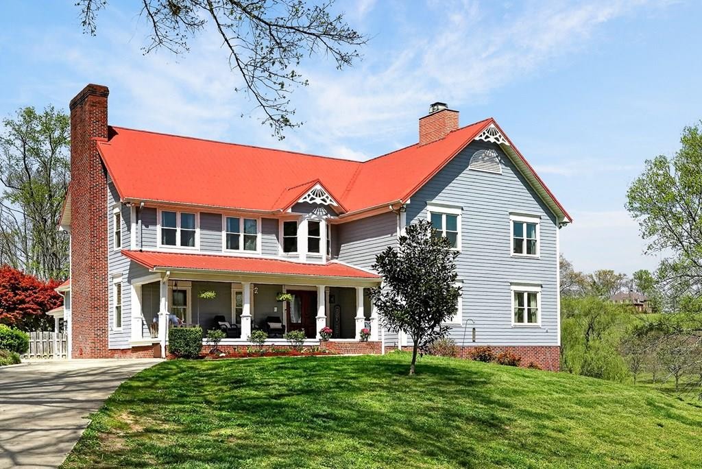 4671 Bunker Hill Road Cookeville, TN 38506 - Photo 2 of 87 a front view of a house with a yard
