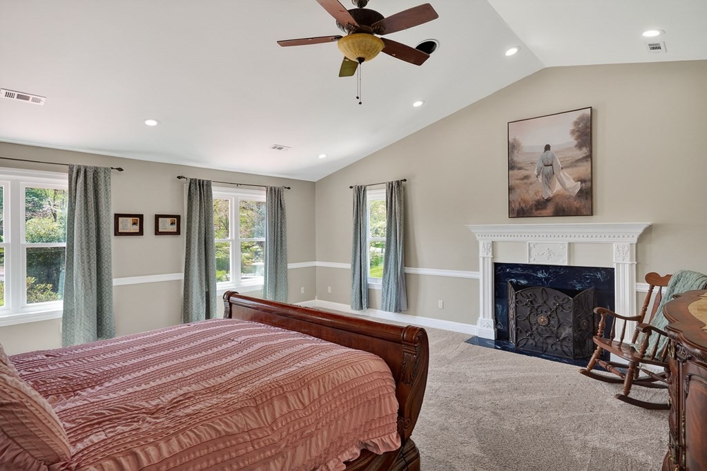 4671 Bunker Hill Road Cookeville, TN 38506 - Photo 25 of 87 a bedroom with a bed and a fireplace