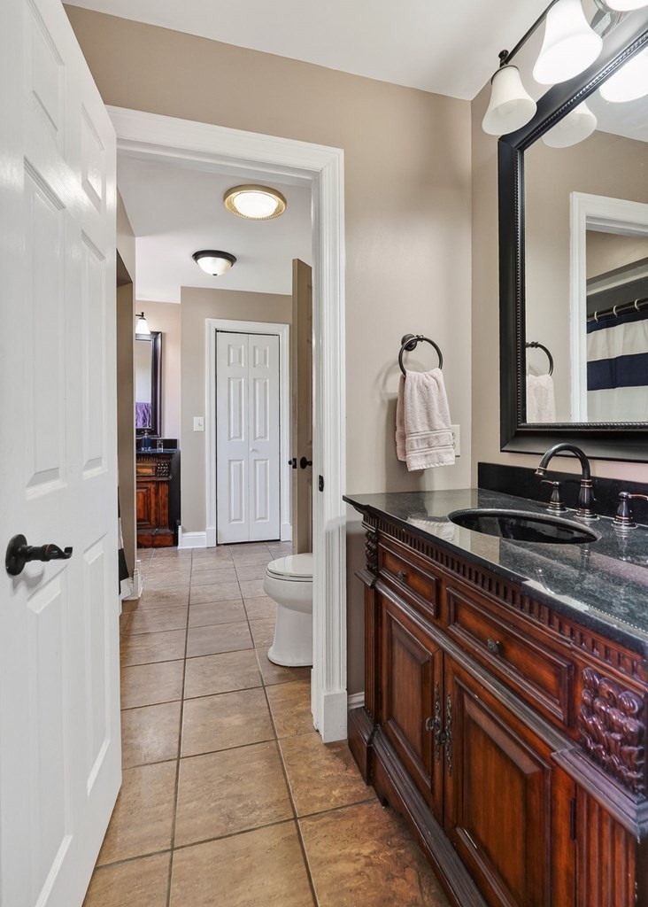 4671 Bunker Hill Road Cookeville, TN 38506 - Photo 44 of 87 a spacious bathroom with a granite countertop sink and a mirror