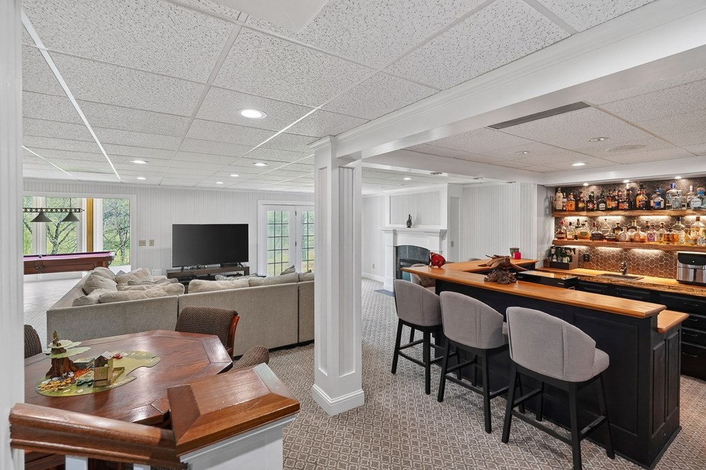 4671 Bunker Hill Road Cookeville, TN 38506 - Photo 48 of 87 a room with furniture a flat screen tv and a window