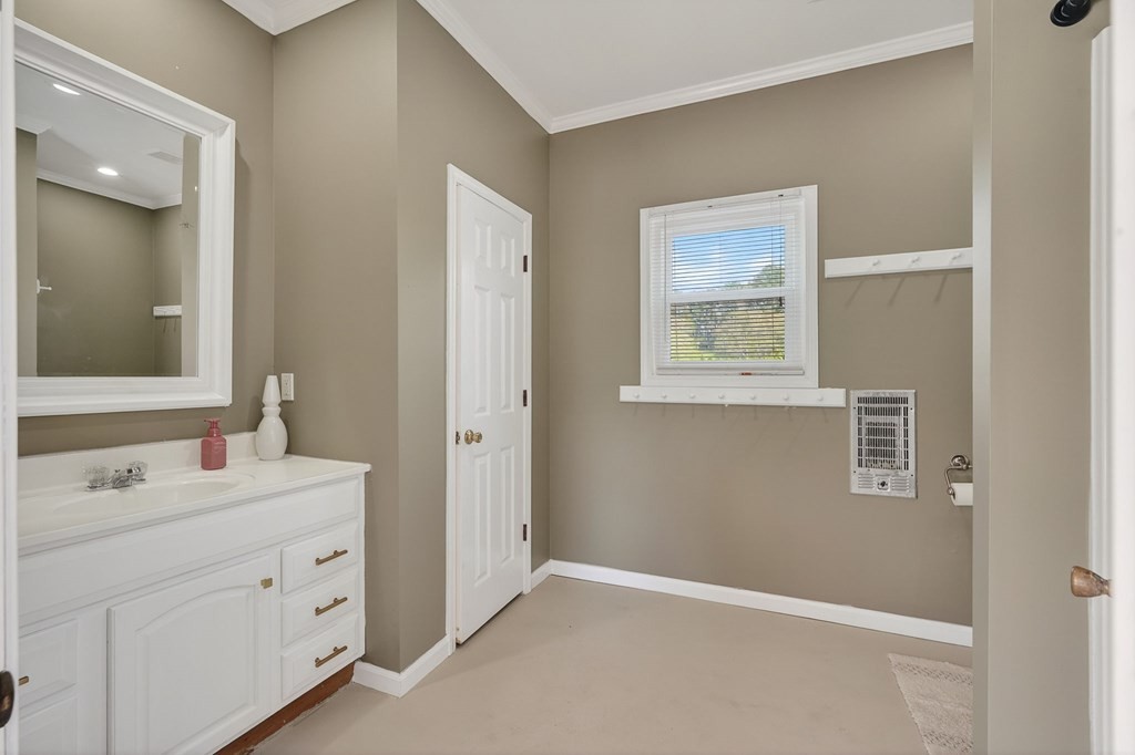 4671 Bunker Hill Road Cookeville, TN 38506 - Photo 61 of 87 a bathroom with a double vanity sink a mirror and a window