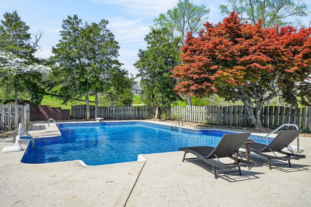 4671 Bunker Hill Road Cookeville, TN 38506 - Photo 65 of 87 a view of a swimming pool with lounge chair
