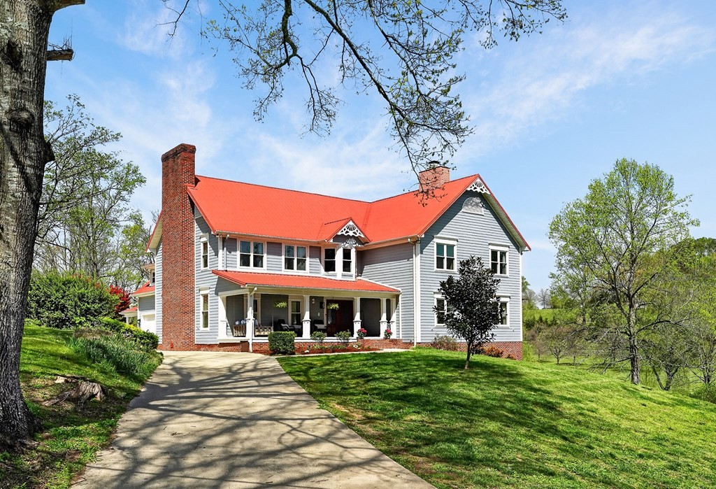 4671 Bunker Hill Road Cookeville, TN 38506 - Photo 71 of 87 a front view of house with a garden and seating area