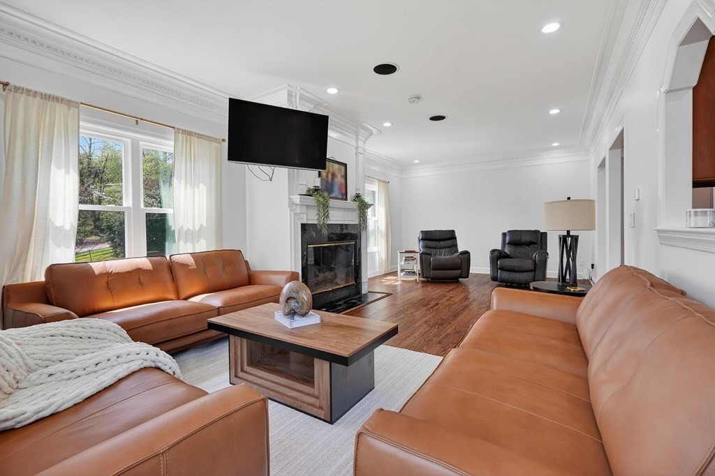 4671 Bunker Hill Road Cookeville, TN 38506 - Photo 8 of 87 a living room with furniture a flat screen tv and a fireplace