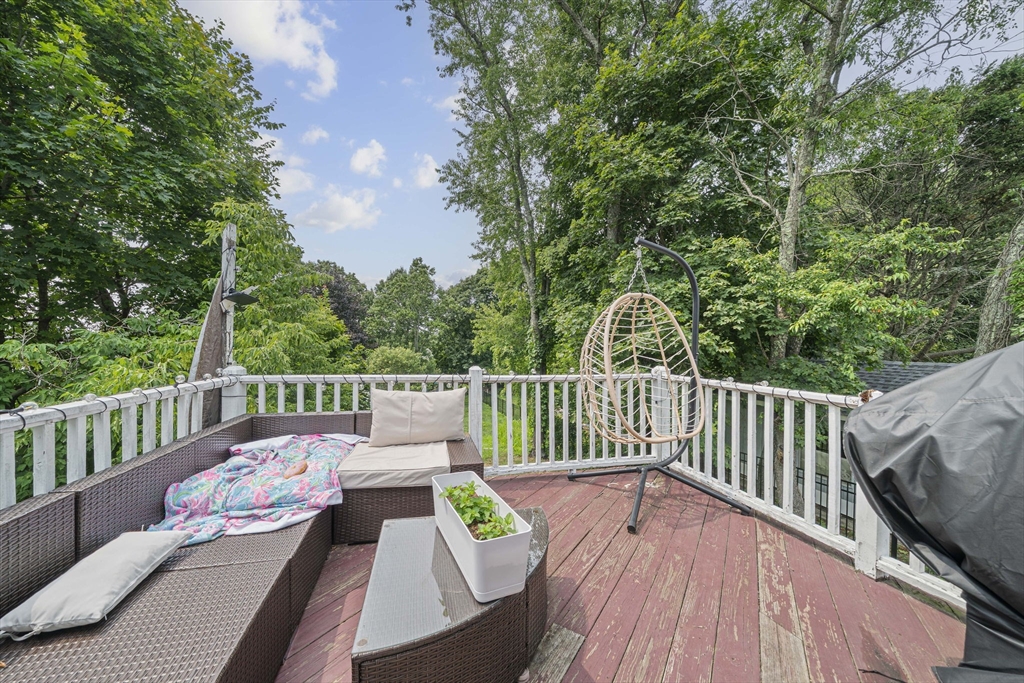 167 Middle Street Braintree, MA 02184 - Photo 11 of 30 a view of a deck with a table and chairs