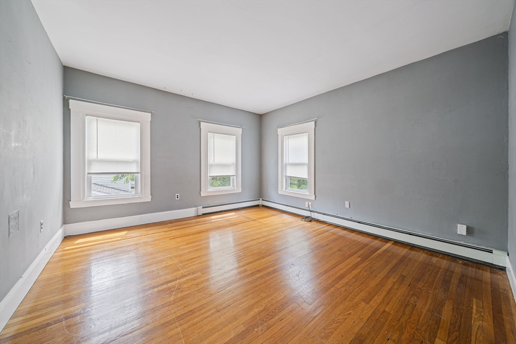 167 Middle Street Braintree, MA 02184 - Photo 15 of 30 an empty room with wooden floor and windows