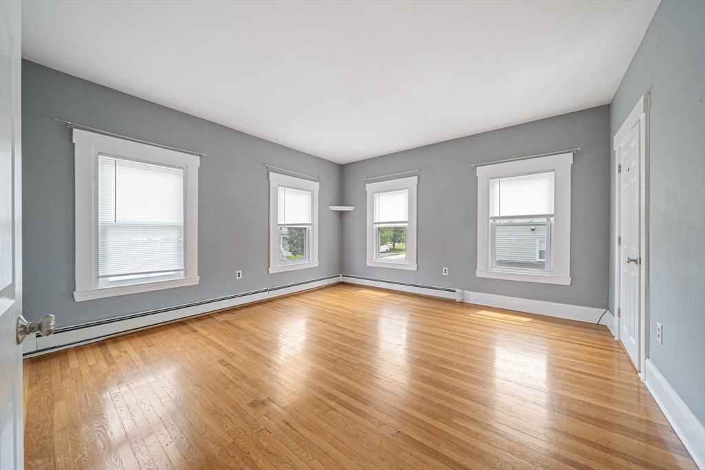 167 Middle Street Braintree, MA 02184 - Photo 17 of 30 a view of empty room with wooden floor and fan