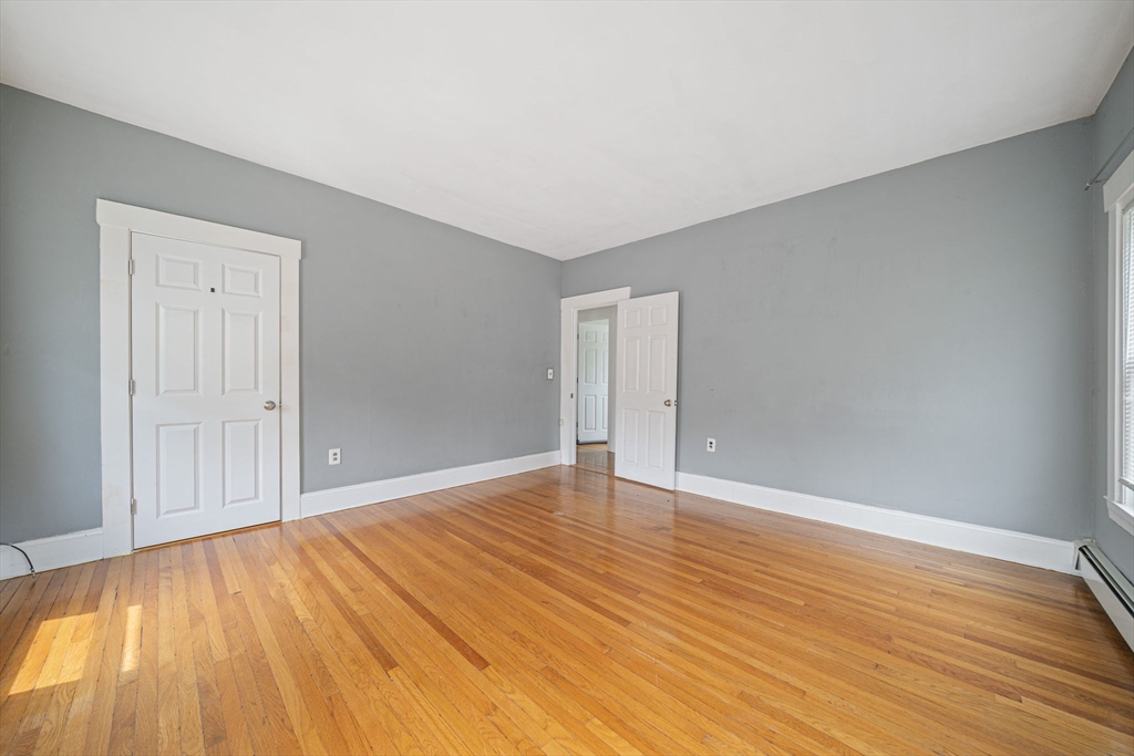 167 Middle Street Braintree, MA 02184 - Photo 18 of 30 a view of an empty room with wooden floor