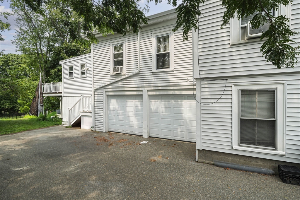 167 Middle Street Braintree, MA 02184 - Photo 24 of 30 a view of a house with a yard and garage