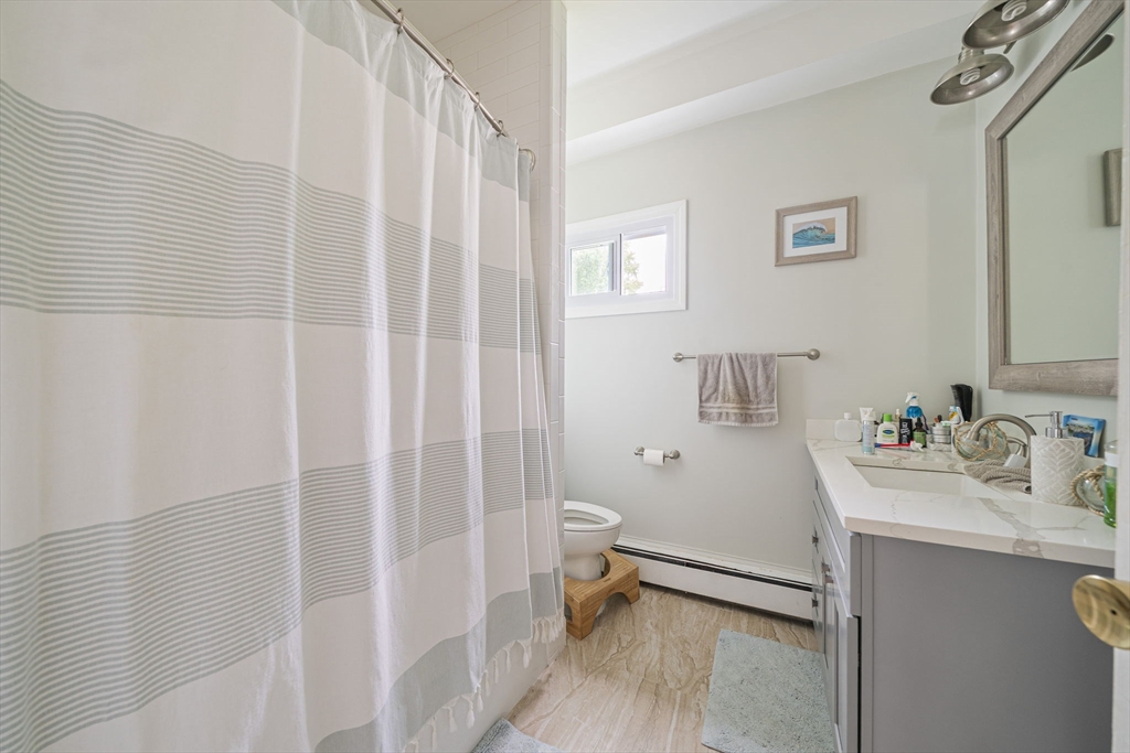 167 Middle Street Braintree, MA 02184 - Photo 6 of 30 a bathroom with a sink a toilet and shower