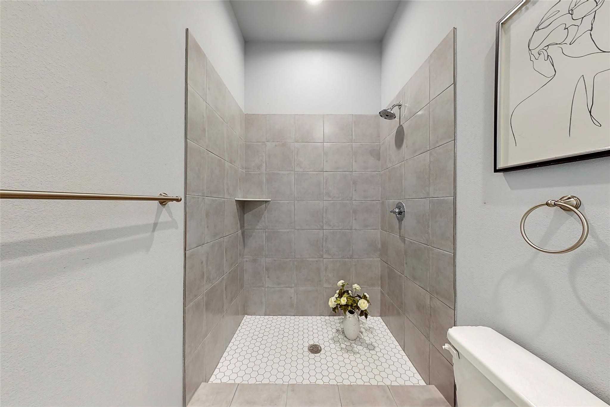 18813 Luminescent Lane Spring, TX 77379 - Photo 18 of 19 a bathroom with a sink toilet and shower
