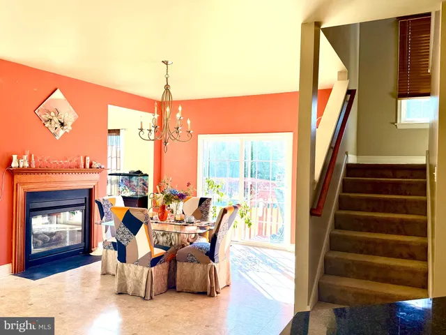 a large kitchen with kitchen island a large window in it