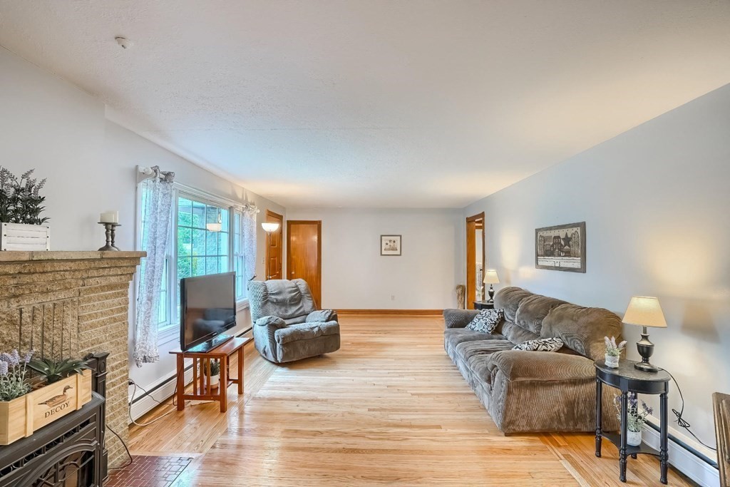 361 South Main Street Bellingham, MA 02019 - Photo 14 of 42 a living room with furniture and a flat screen tv